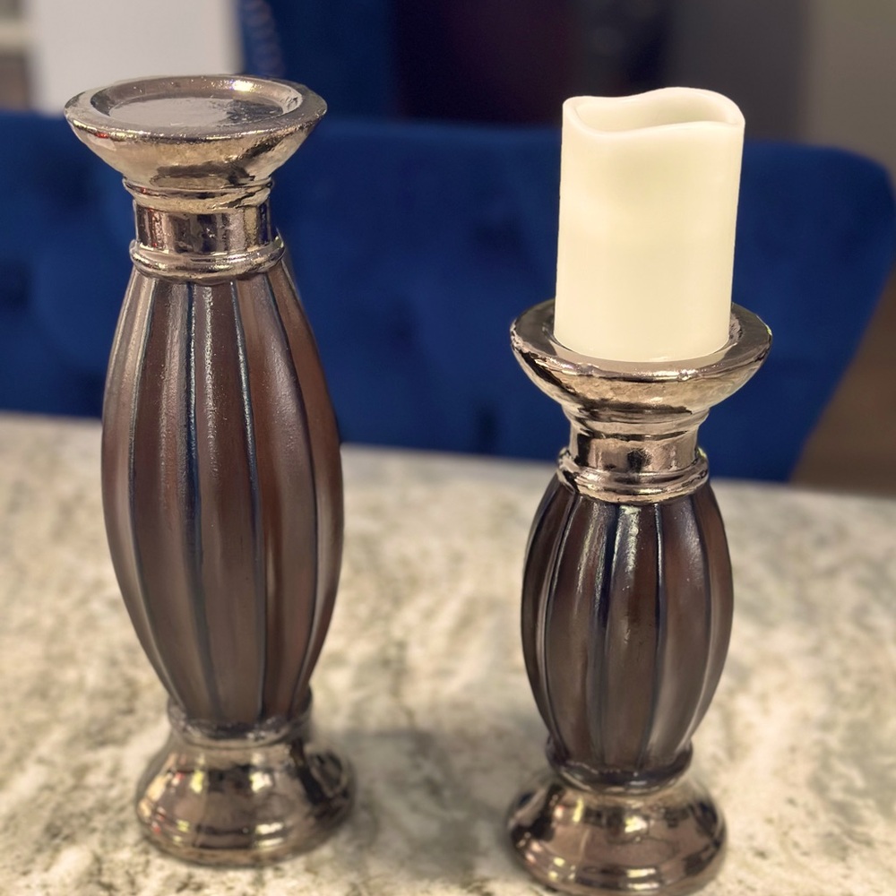 Set of two ceramic candle holders. Brown with gold base and top.